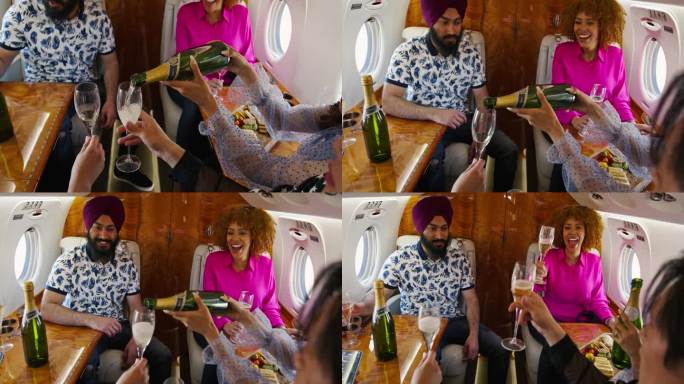 各种各样的私人飞机乘客一起倒香槟，碰杯