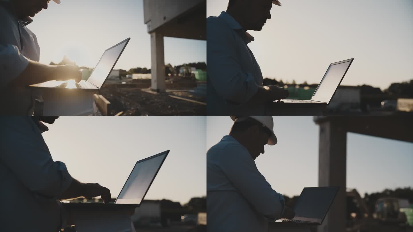 特写男工程师在阳光明媚的建筑工地使用笔记本电脑
