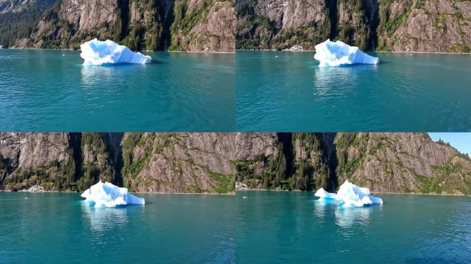冰山漂浮在水面上。在阳光明媚的日子里，美丽的山海和绿松石般的海水。全球变暖。气候变化。随着全球气候变