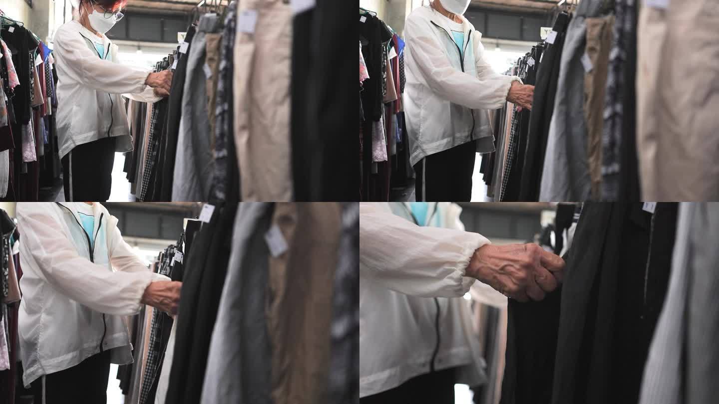 一名妇女在一家时尚零售店疯狂购买衣服