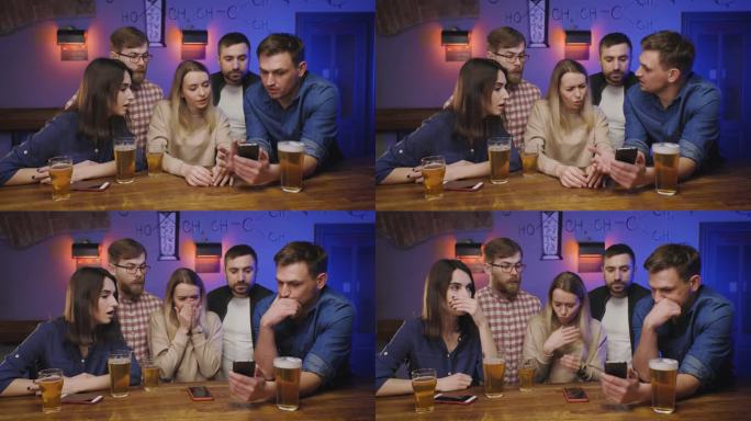 酒吧里的朋友们端着啤酒在吧台边看手机。一名男子在手机上向朋友们展示了一些恶心的东西，朋友们正在做鬼脸