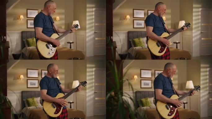 老人在家边唱歌边弹吉他