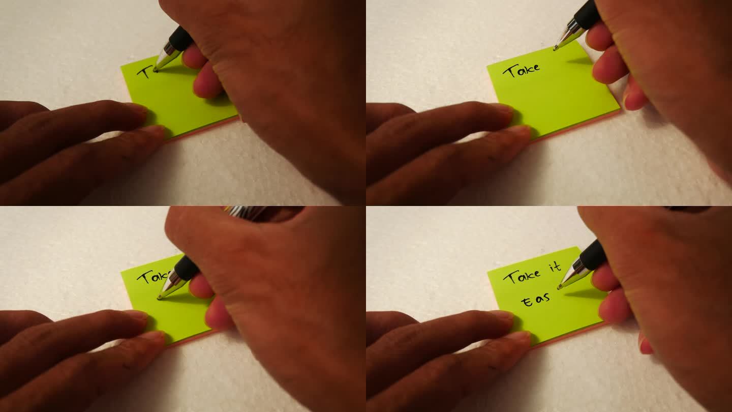 一个男人的手在一张黄色的便条纸上写着“TAKE”