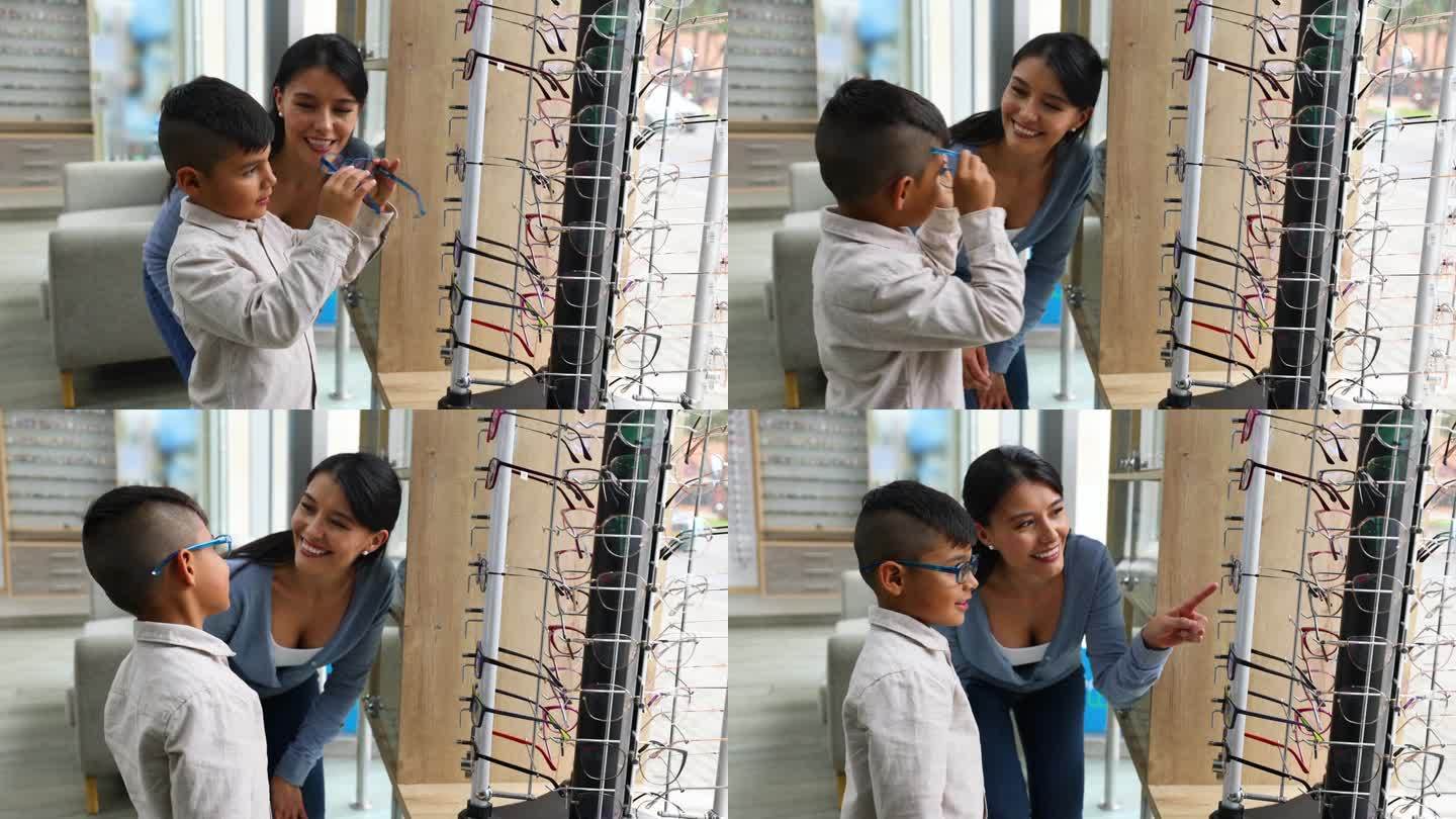快乐的拉丁美洲男孩和他的母亲在验光店买眼镜