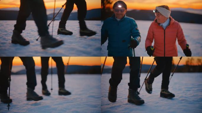 一对老年夫妇在黄昏的雪地里行走时使用大灯