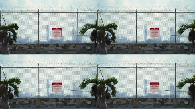 迈阿密机场跑道周围的保护性带刺铁丝围栏是防止非法侵入的安全措施