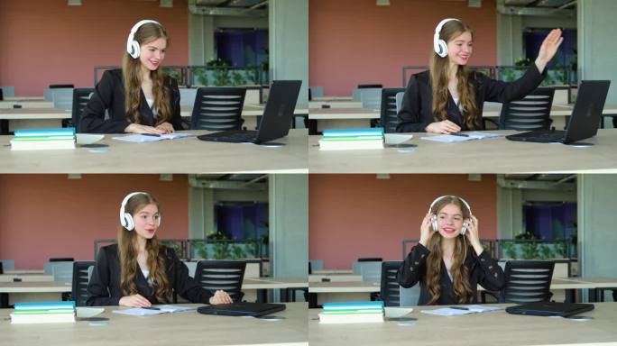 专注的女生戴着耳机在课堂上使用笔记本电脑，有吸引力的女生学习语言，观看在线网络研讨会，听音频课程，e