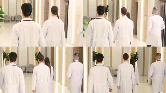 一组医生正在边走边讨论治疗病人的方法。
