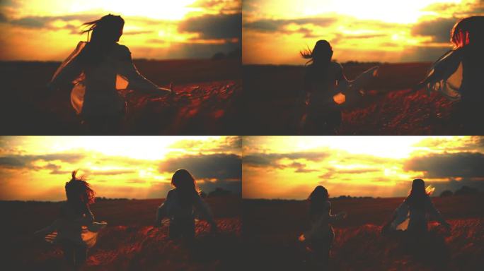 慢镜头:夕阳下，橙色的天空下，闺蜜在麦田里奔跑