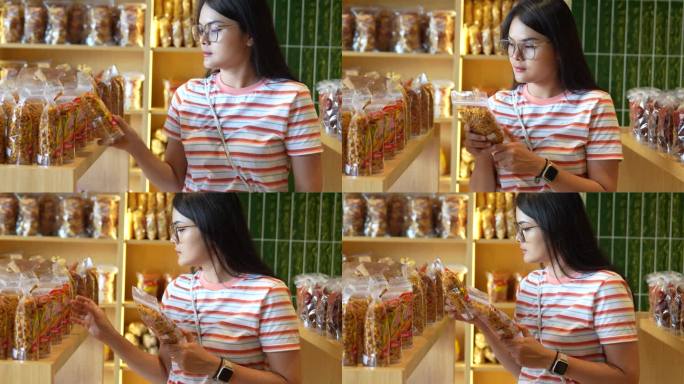 在印尼小吃店买零食的年轻女性
