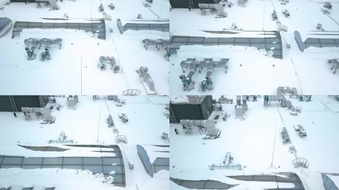 冬天，工人们检查积雪覆盖的工程设备，飞机飞过购物中心的屋顶