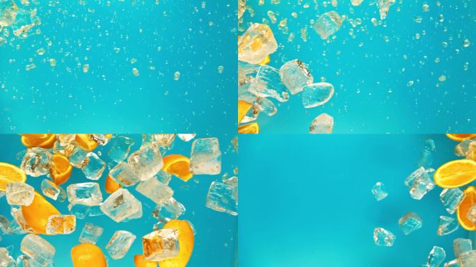 多汁的甜橙和飞冰块或水飞溅或倒滴果汁在1000帧/秒的超级慢动作。在蓝色背景下，以1000帧/秒的超