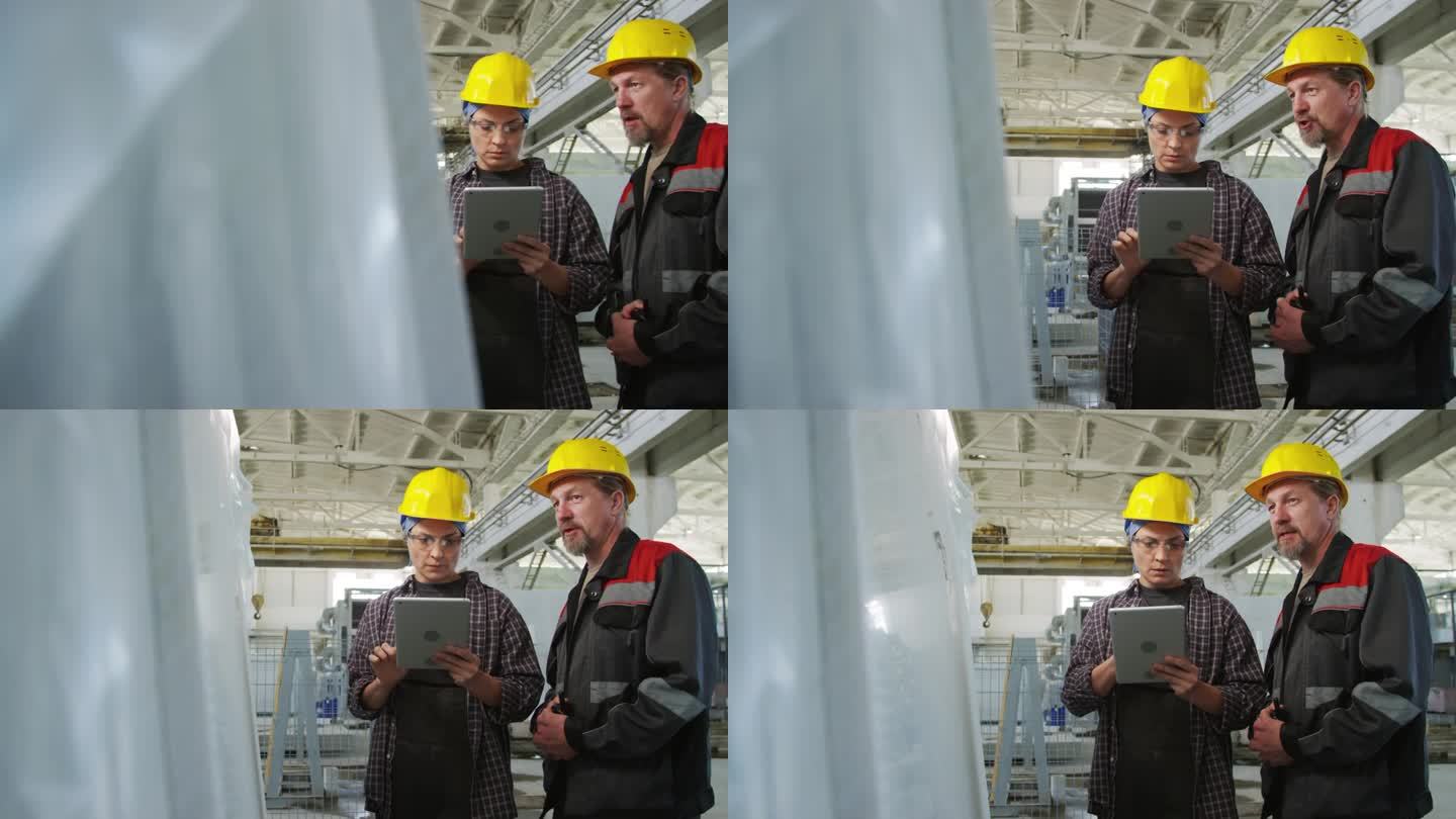 女工程师在石材厂用平板电脑与同事交谈