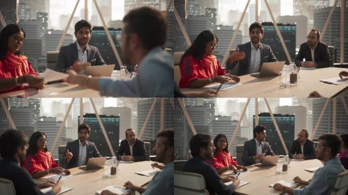 会议室里的办公室会议:英俊的印度专家与不同的商务团队谈论公司战略。雄心勃勃、富有创造力的创业团队讨论