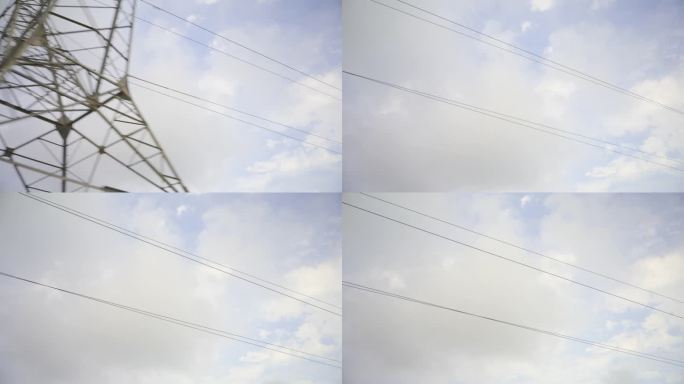 一个大型电塔，电缆横跨蓝天白云