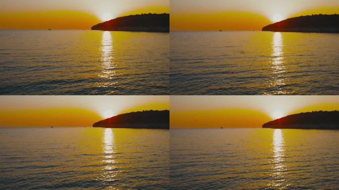 风景优美的海景，日落时水面上的阳光反射