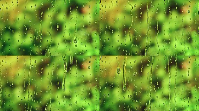 在明亮的绿色背景下，雨滴从窗户滑下