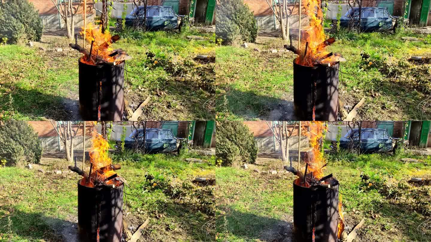 干树枝在桶里燃烧，春秋大扫除