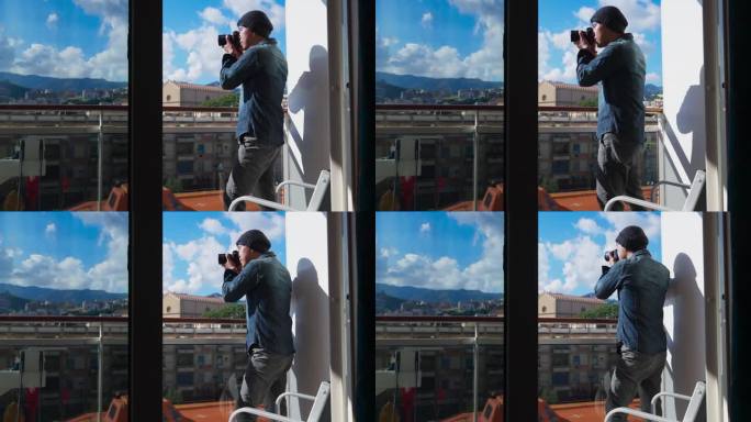 亚洲男摄影师旅行者穿着休闲的衣服在他的游轮阳台房间拍照，潮人在意大利用相机捕捉瞬间