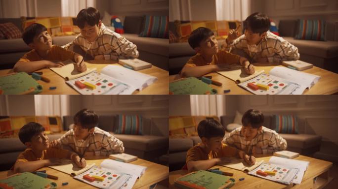 一个聪明的小男孩在父亲的帮助下做作业，父亲教他独立思考和勤奋。专注的孩子学习，努力学习。成功的韩国家