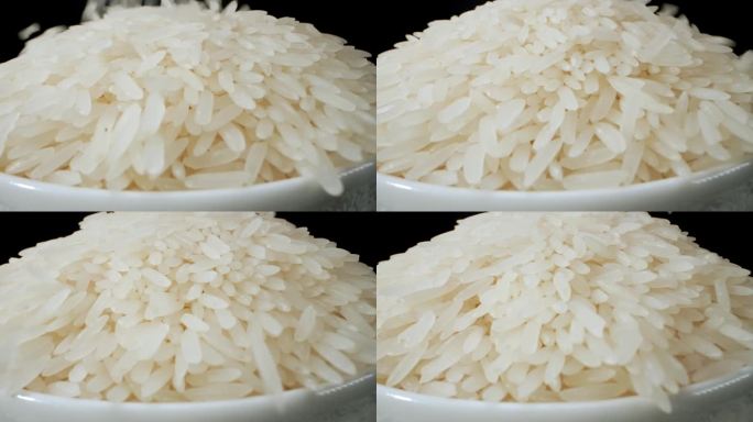 在微距视频中，将茉莉花米饭倒在碗上