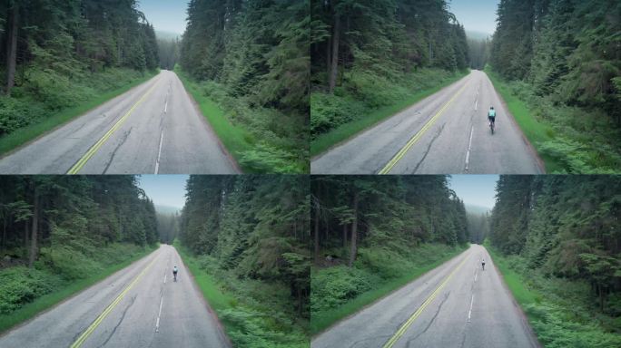 男子骑自行车上山公路的航拍