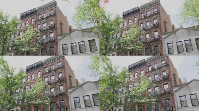 纽约市四层和五层的砖砌公寓楼一排排排列着消防通道和华丽的装修