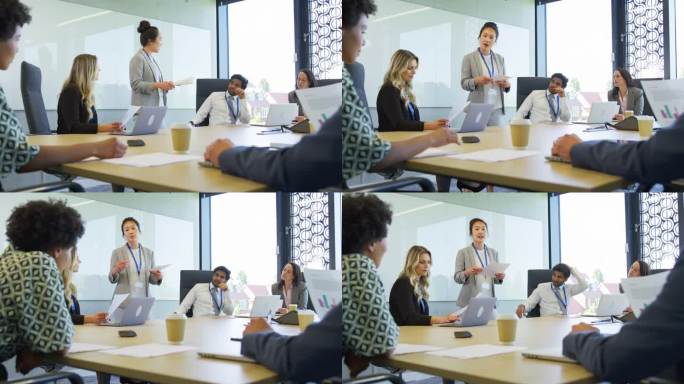 商务女性领导多元文化的商务团队在办公室开会和合作