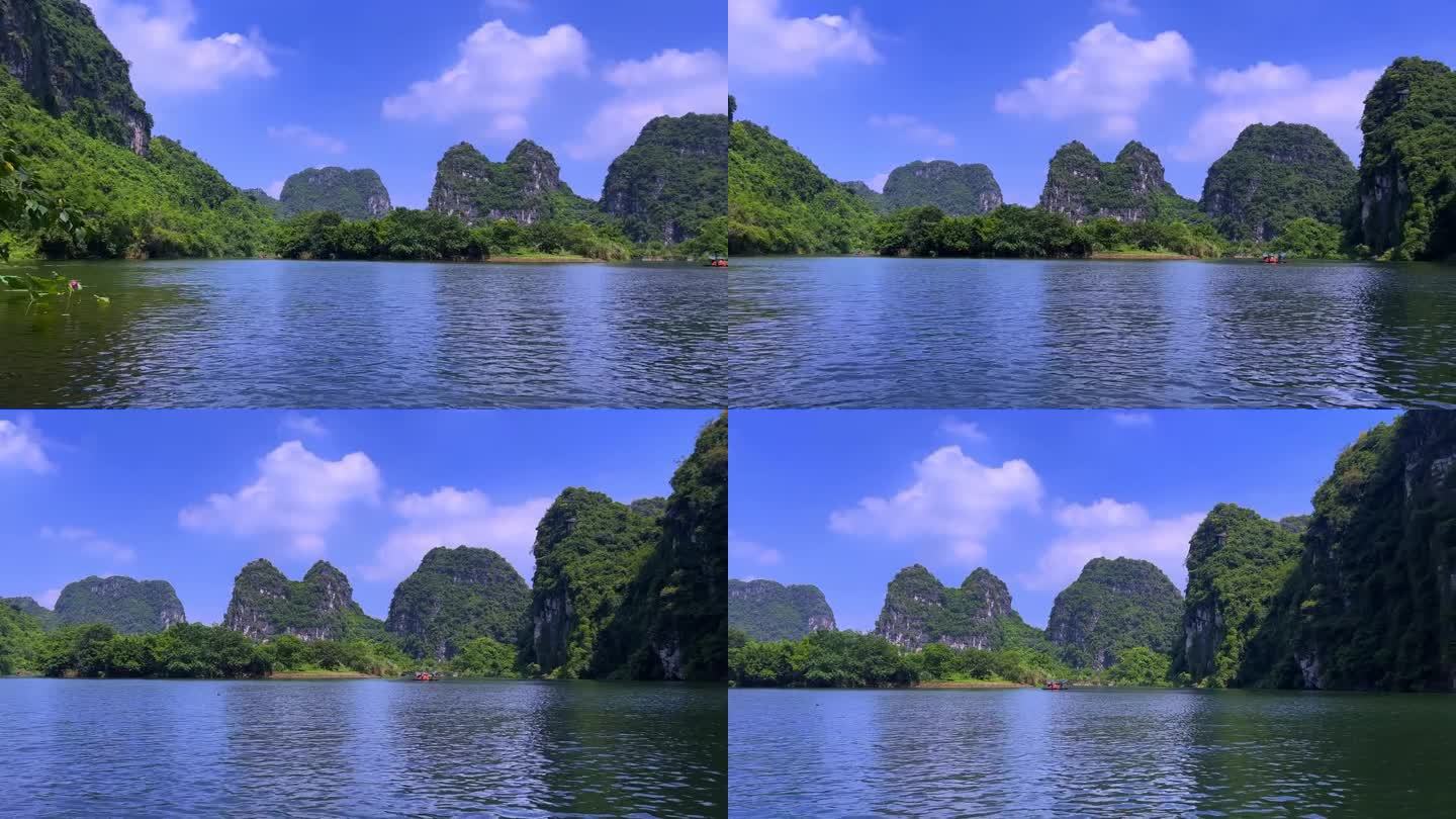 越南的庄安河、宁明和白定山距离河内只有3小时的车程。美丽蜿蜒的河流和高耸的高山。船穿过河中的洞穴