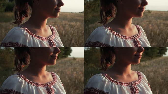 身着传统装饰的乌克兰女子站在麦田里。民族服装-刺绣，纹理，图案，民间，手工工艺刺绣