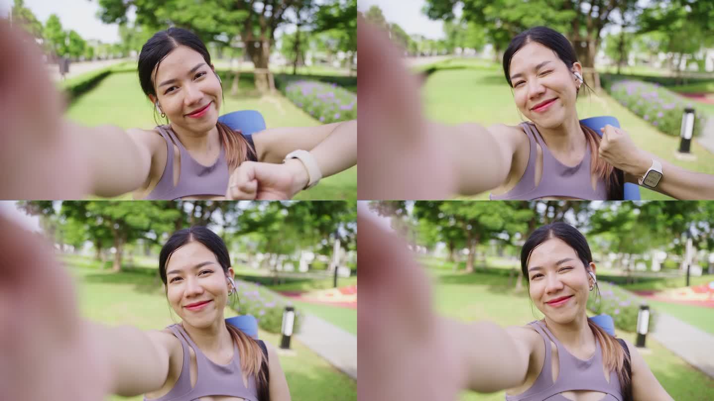 一名亚洲女性在公园背景下做瑜伽和锻炼后使用智能手机。运动减肥，增加柔韧性和收紧形状。