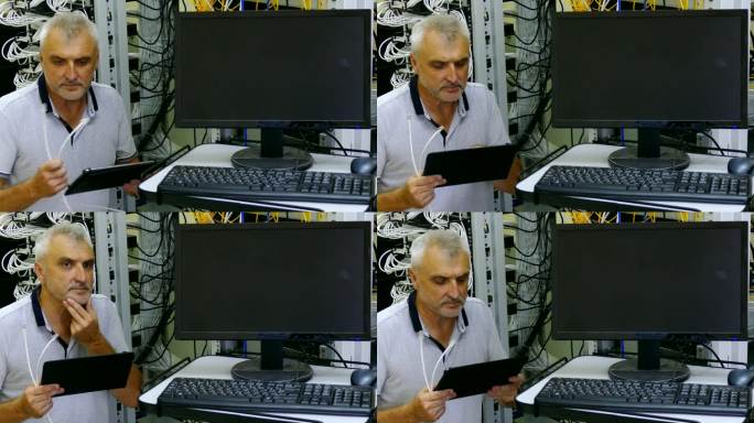 工程师带着平板电脑在服务器机房