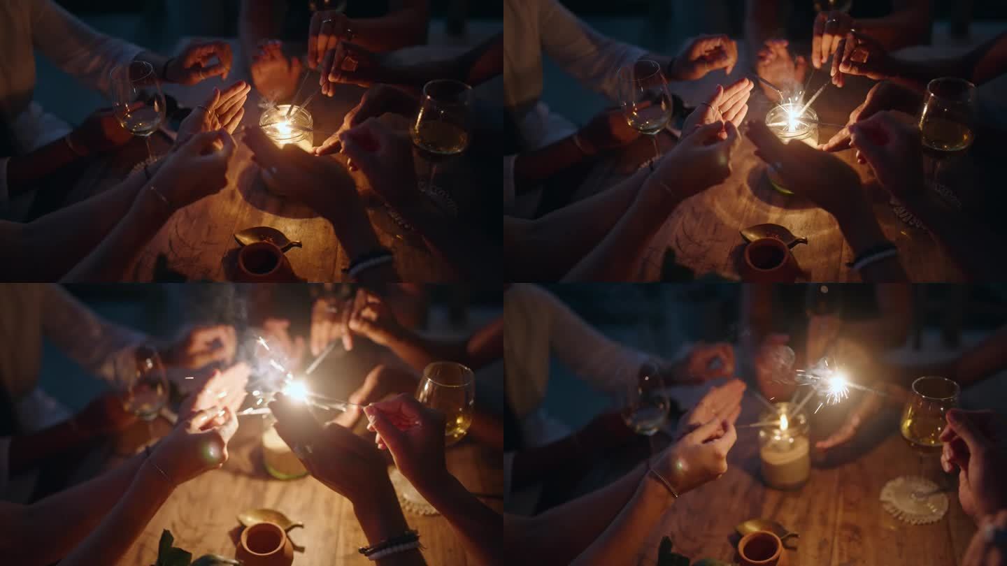 女人的手拿着火花点燃蜡烛。孟加拉光在妇女手中特写。女孩们拿着闪闪发光的灯，试图点亮它们。新年庆祝活动