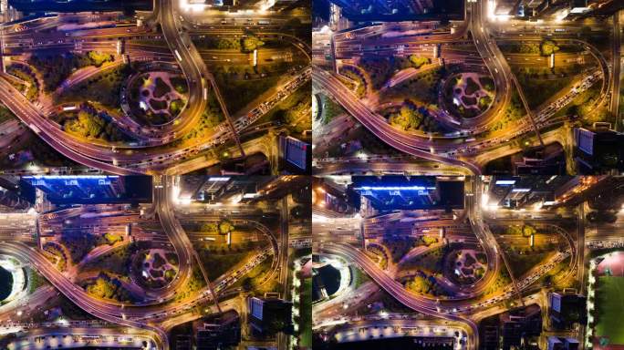 超延时延时汽车交通运输在道路上，摩天大楼的建筑物灯光交响乐表演在维多利亚港香港岛。无人机航拍夜景。亚