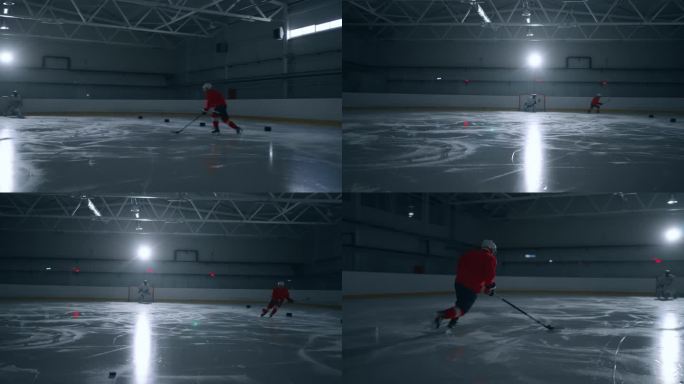 一名身穿红色运动衫的曲棍球专家在黑暗的冰场上训练，熟练地躲避障碍物，并向守门员进球