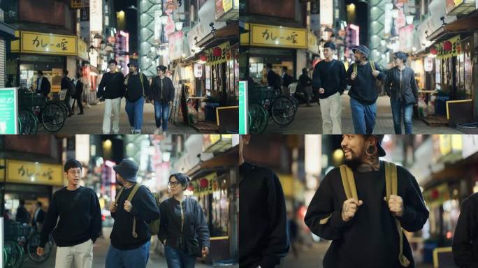 晚上，一群亚洲游客朋友走在东京的街道上，探索这个小镇。