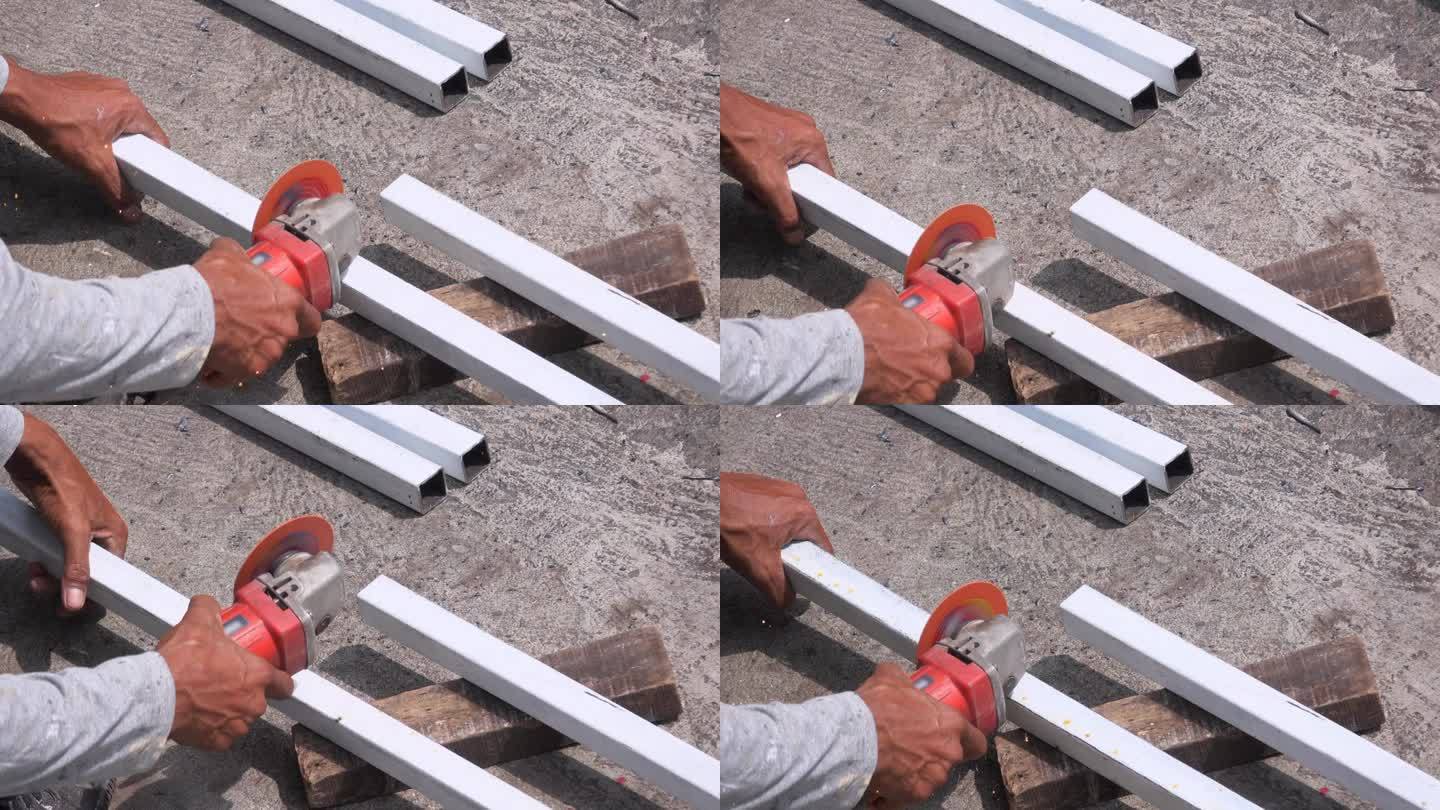 工人使用角磨床加工金属棒