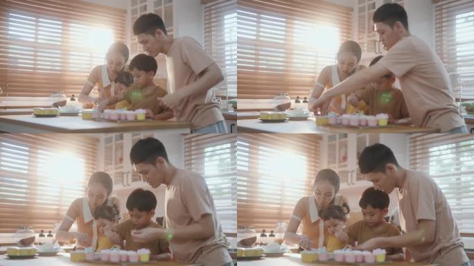 厨房里的幸福:亚洲家庭自制纸杯蛋糕。