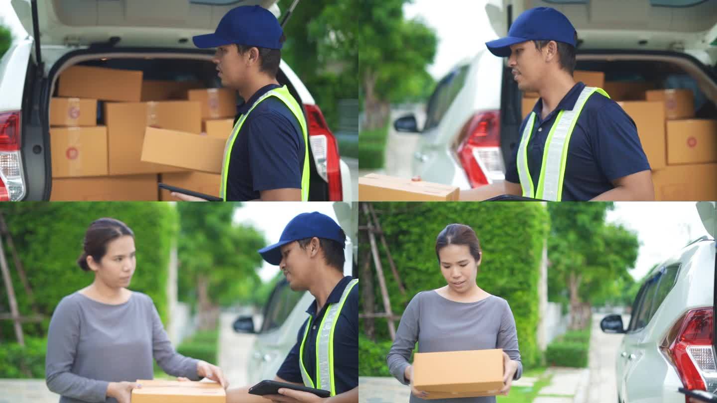 在一个阳光明媚的日子里，一名亚洲女子在她家门前收到了快递员送来的包裹。