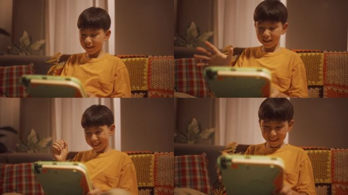 一个快乐兴奋的孩子在家里的客厅里使用平板电脑的中等肖像。聪明的男孩在一个教育游戏中获胜，达到高分，庆