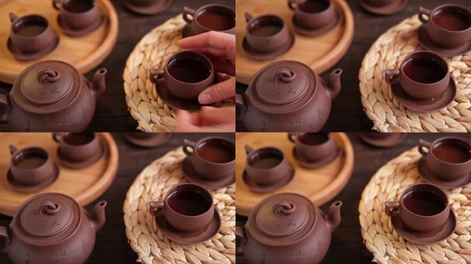 茶道。亚洲传统茶具，正宗茶具套装。把茶从茶壶倒进茶杯的人。竹托盘。的生活方式。健康平衡健康。泡茶设备