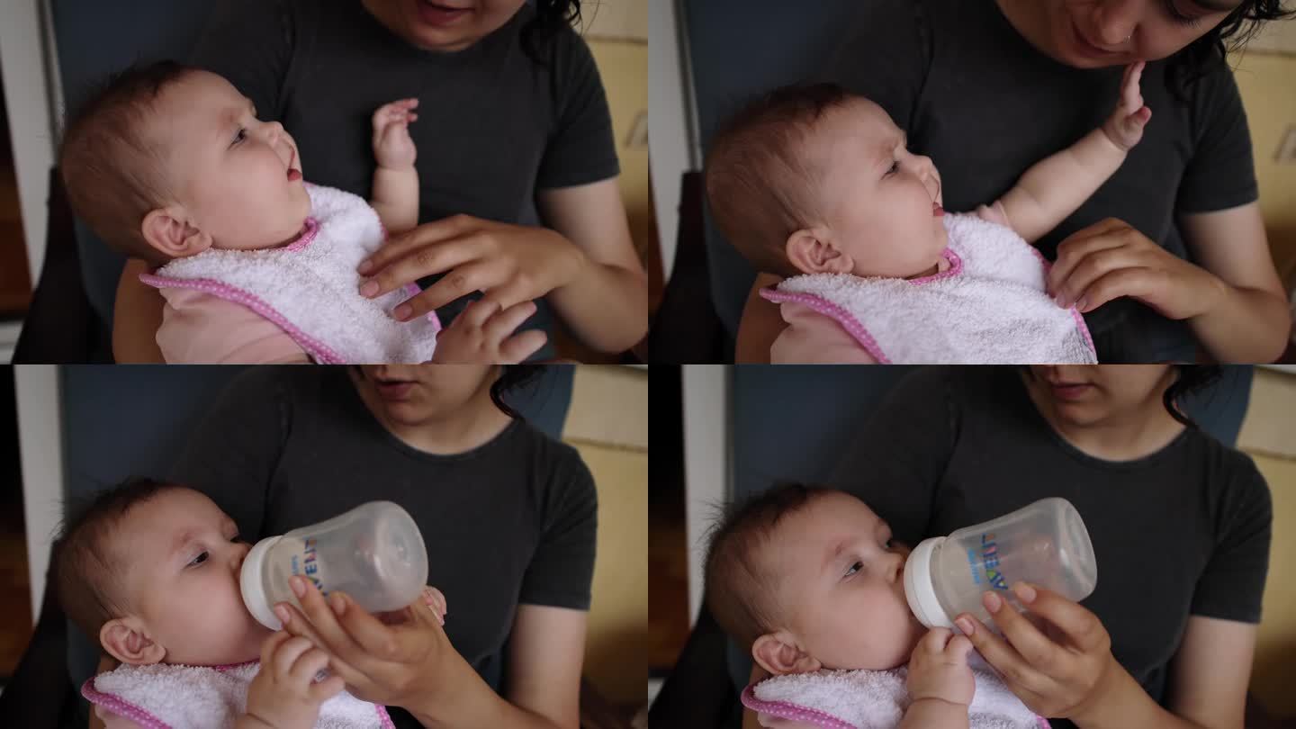 B-roll的用法和样例:母亲用婴儿杯里的牛奶喂她的女婴