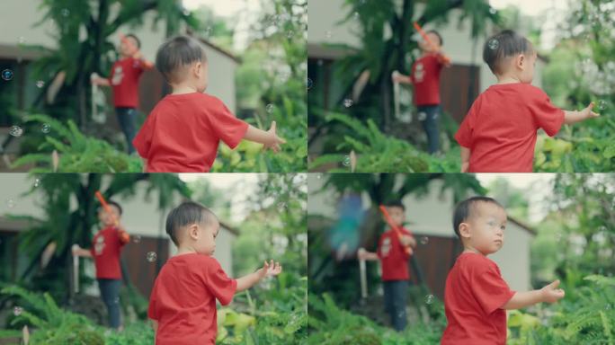 充满活力的快乐的亚洲孩子专注于吹肥皂泡:顽皮的天真释放