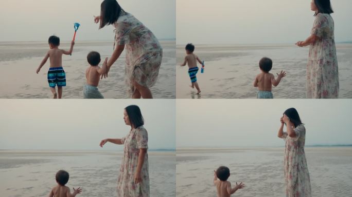 一位亚洲母亲带着孩子在泰国普吉岛的海滩上快乐地共度时光。假期的概念。