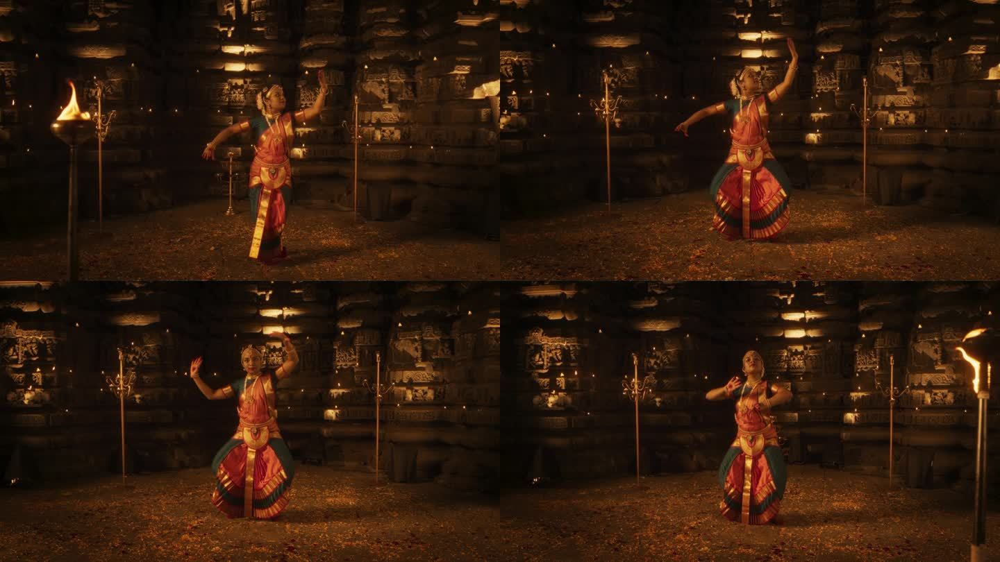 迷人的慢动作肖像印度女舞者表达自己通过迷人的民间舞蹈编排在一个古老的寺庙。她穿着传统服装，跳着Bha