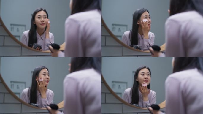 美丽的韩国女性在家里的浴室化妆。年轻女子使用面部化妆品软化皮肤。迷人的亚洲女孩享受她的早晨美容程序