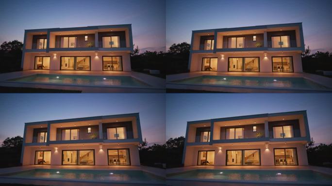 CS现代豪华的房子与一个游泳池在晚上