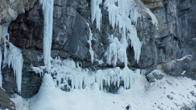 Aerial shot of two sportsmen walking to climb an i