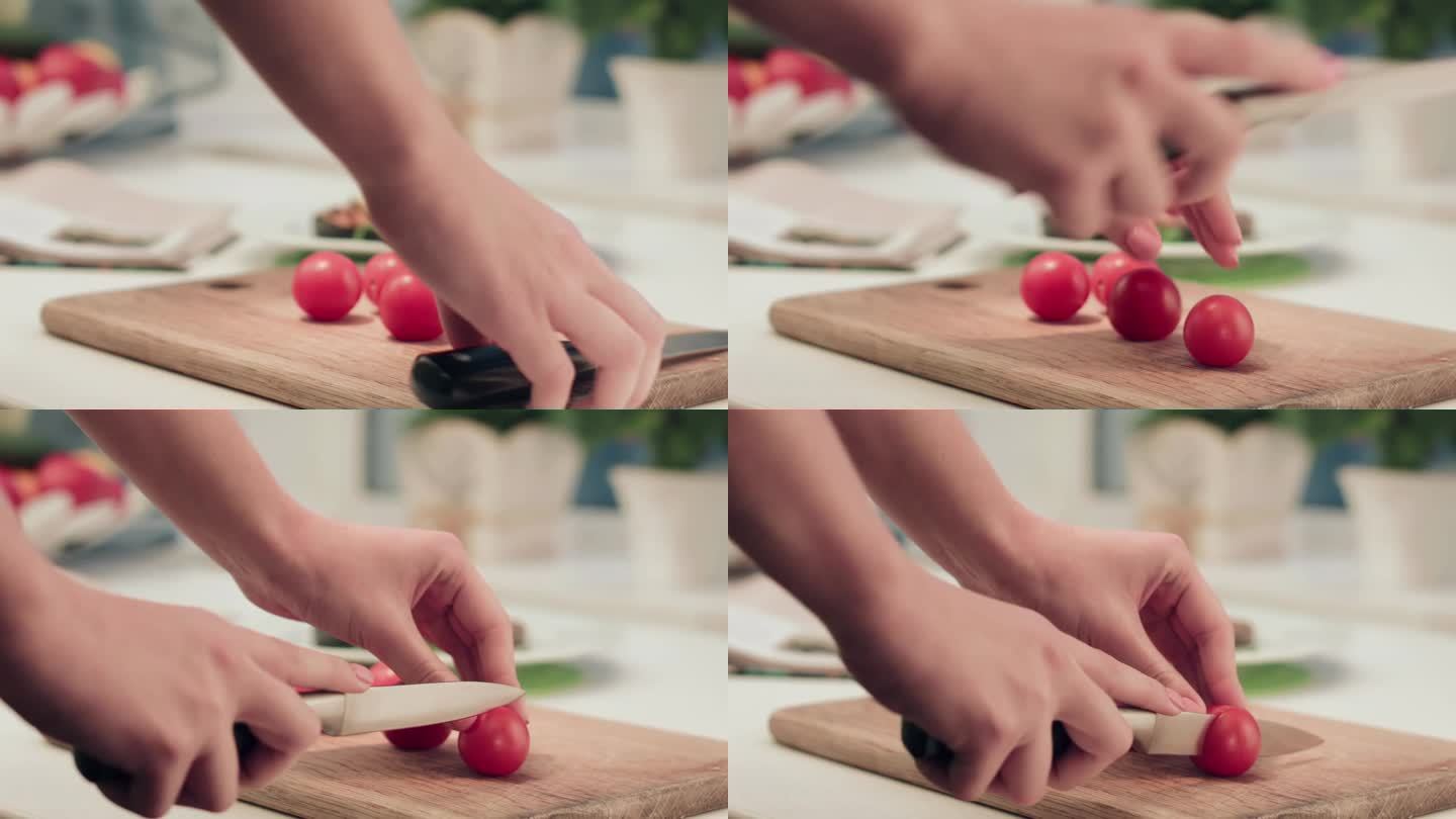女人在烹饪时用一把锋利的刀切迷你西红柿