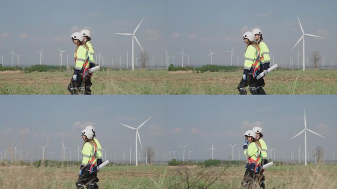 两位工程师正在检查风力涡轮机。